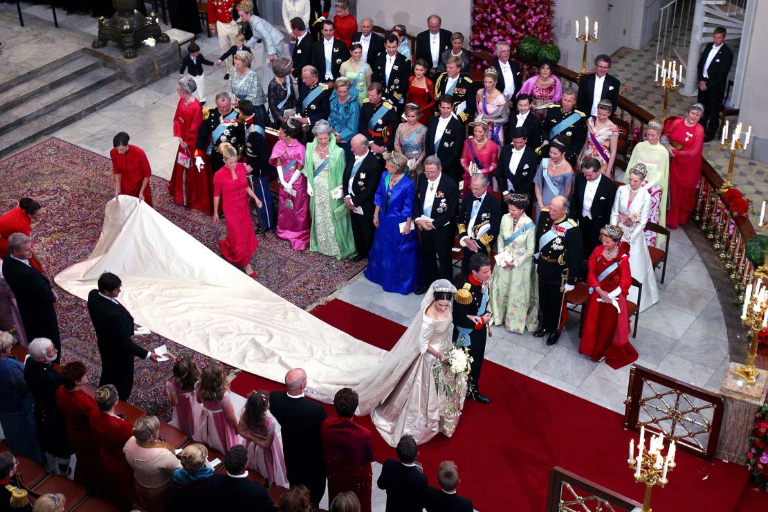 Crown Prince Frederik of Denmark and Australian born Crown Princess Mary Elizabeth Donaldson walk down the aisle after the wedding ceremony in the Copenhagen Cathedral 14 May 2004. (Photo by BJARKE ORSTED / SCANPIX / AFP) (Photo by BJARKE ORSTED/SCANPIX/AFP via Getty Images)